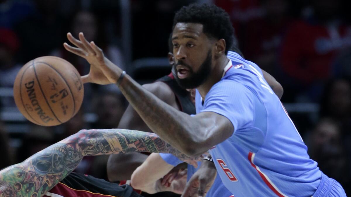 Clippers center DeAndre Jordan steals the ball from Miami Heat forward Chris Andersen during a game at Staples Center on Jan. 11.