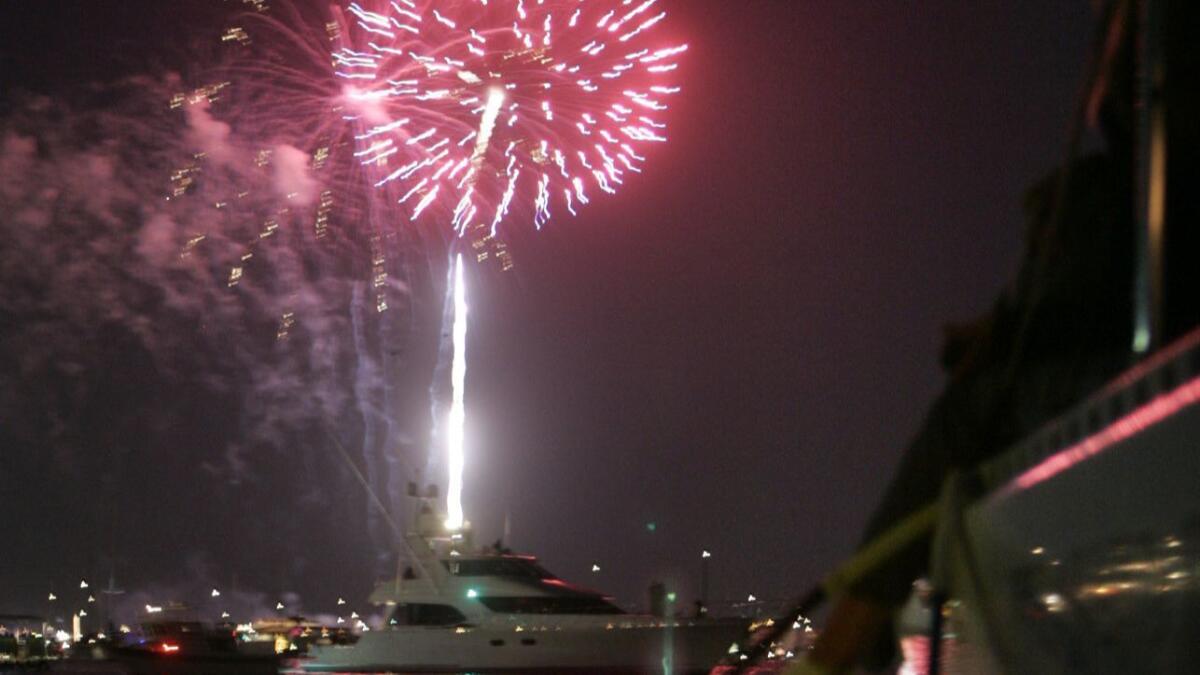 Fourth of July fireworks launched from a floating barge near Marina del Rey.
