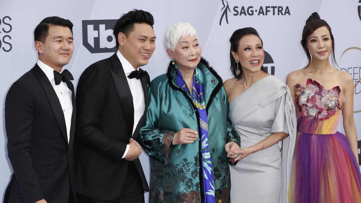 "Crazy Rich Asians" director Jon M. Chu, second from left, is joined by cast members from the film.