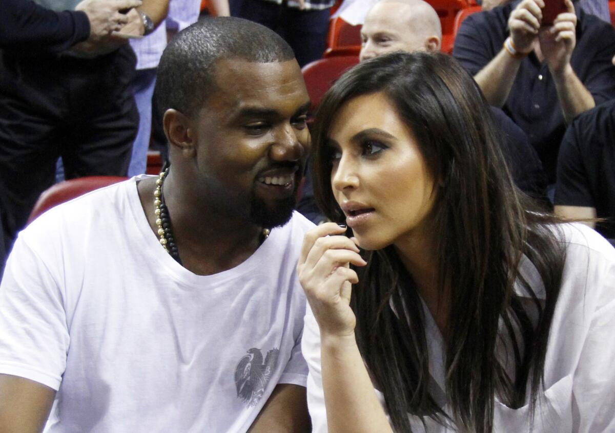 Kanye West with Kim Kardashian, the only person he follows on Twitter. But he seems to be taking to Twitter more often these days ... as a film critic.