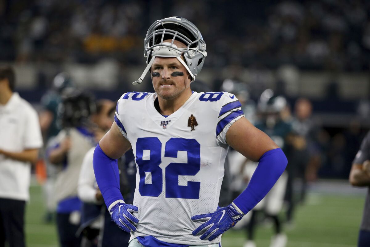 FILE - In this Oct. 10, 2019, file photo, Dallas Cowboys' Jason Witten (82) warms up before an NFL football game against the Philadelphia Eagles in Arlington, Texas. After 16 seasons in Dallas and one in the "Monday Night Football" booth, Jason Witten now is adjusting to a new home with the Las Vegas Raiders. (AP Photo/Ron Jenkins, File)