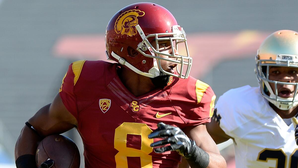 USC receiver George Farmer runs for one of his two touchdowns during the Trojans' 49-14 win over Notre Dame on Nov. 29.