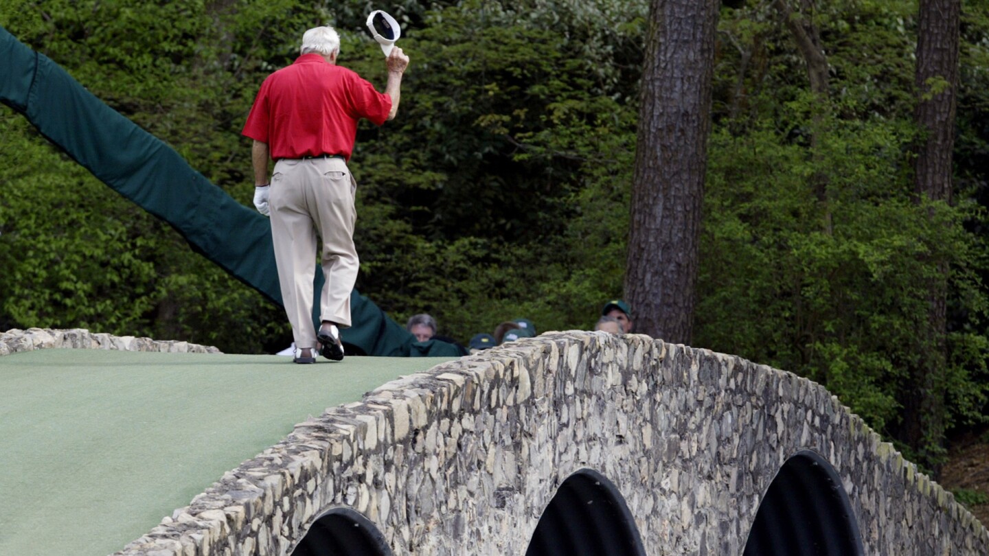 2004: Arnold Palmer walking across the Hogan Bridge on the 12th fairway for the final time in Masters competition during the second round of the Masters golf tournament at the Augusta National Golf Club in Augusta, Ga.