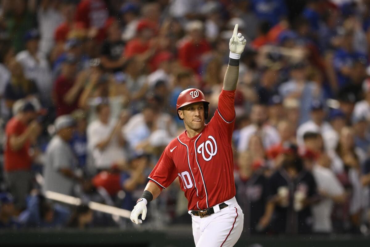 Washington's Yan Gomes celebrates his three-run home run during the fourth inning against the Dodgers on Saturday.