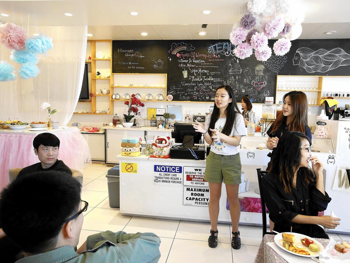 Single men and women gather at Lin's Wonderland Tearoom in the City of Industry for an event sponsored by the Chinese-language dating site 2RedBeans.