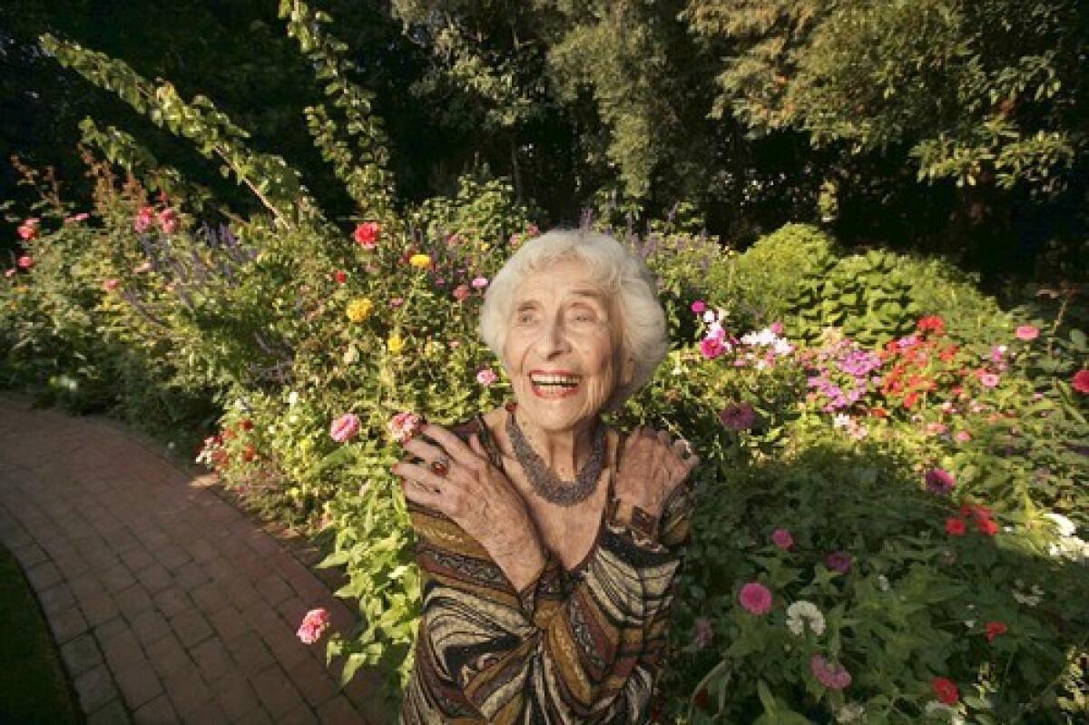 Hedda Bolgar, in the garden at her Brentwood home, is a psychologist and psychoanalyst who still sees patients four days a week.