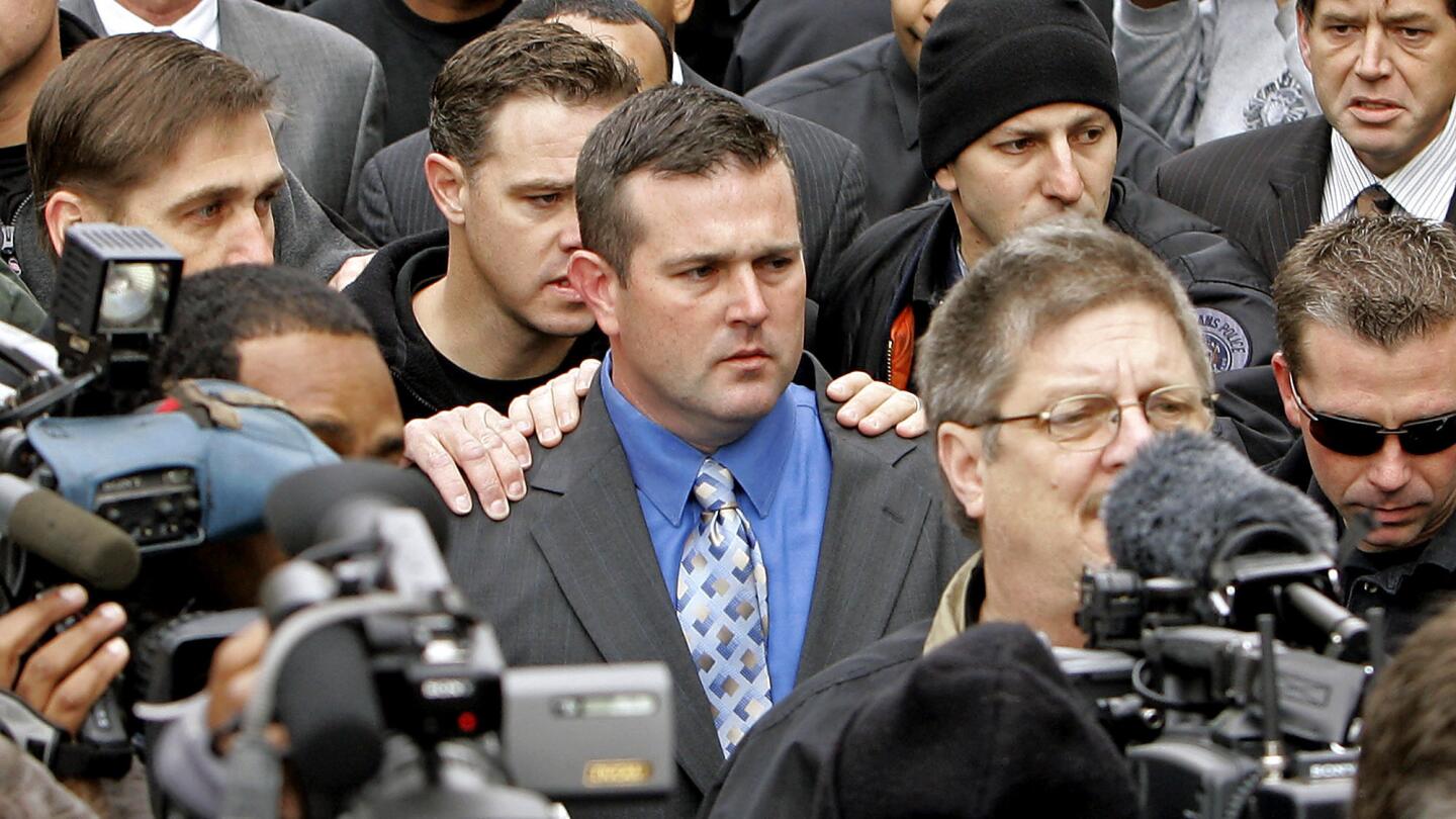 New Orleans police Sgt. Robert Gisevius, center, in 2007. In 2011, federal prosecutors won civil rights and obstruction of justice cases against Gisevius and four other officers, but a judge has ordered a new trial because of anonymous online comments posted by prosecutors.
