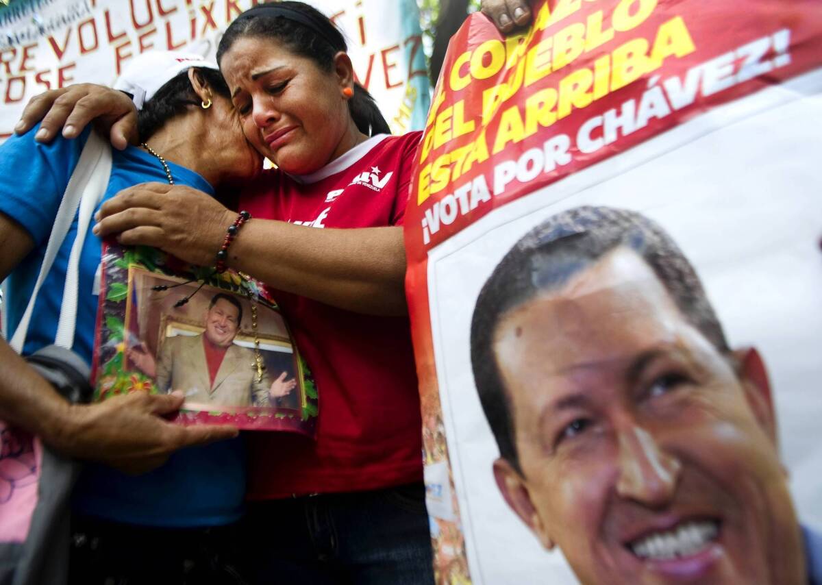 Supporters of Venezuelan President Hugo Chavez gather outside the National Assembly in Caracas. The leader is being treated for cancer in Cuba and details of his condition are not known.