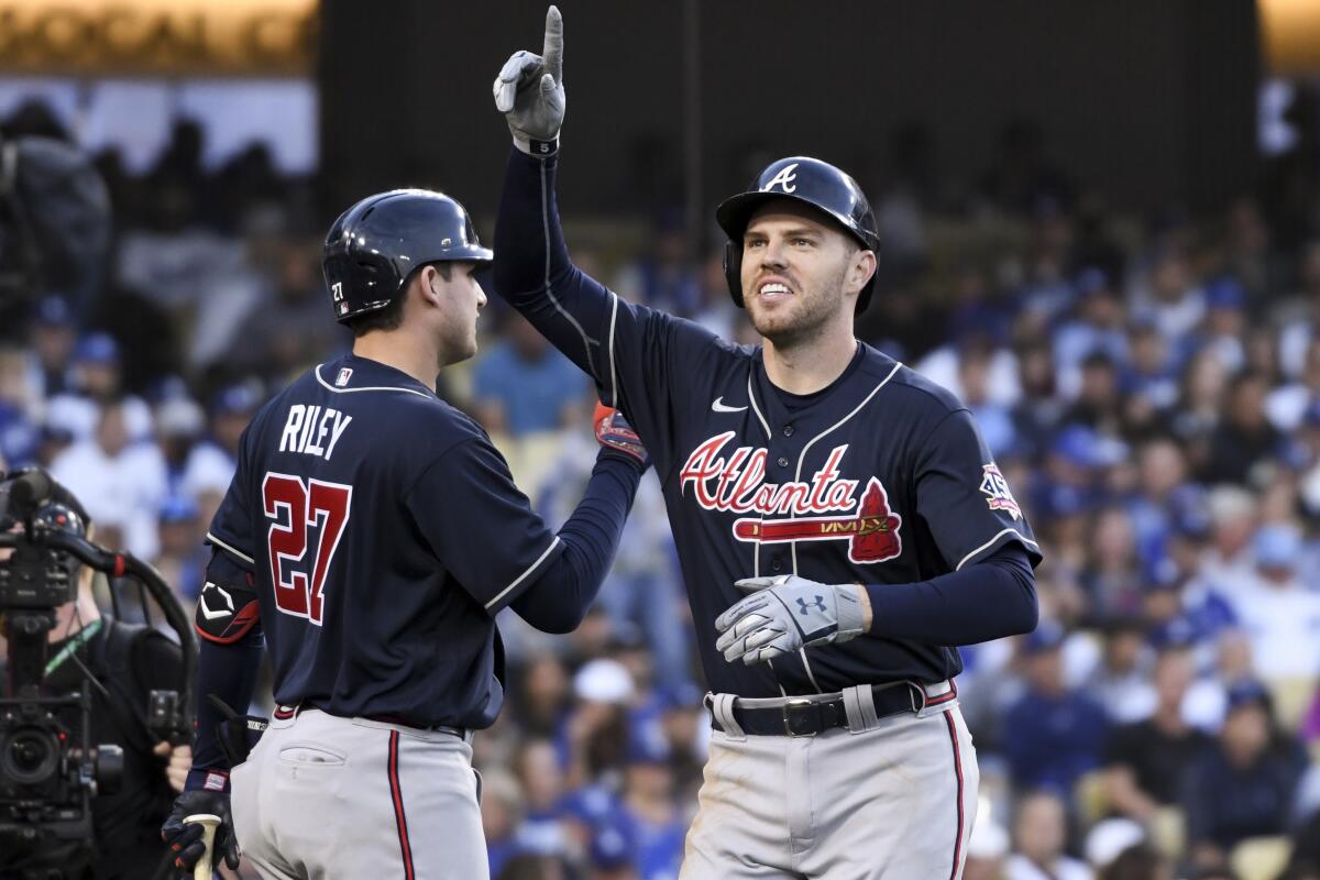 Atlanta Braves first baseman celebrates a home run against the Dodgers on Oct. 20, 2021.