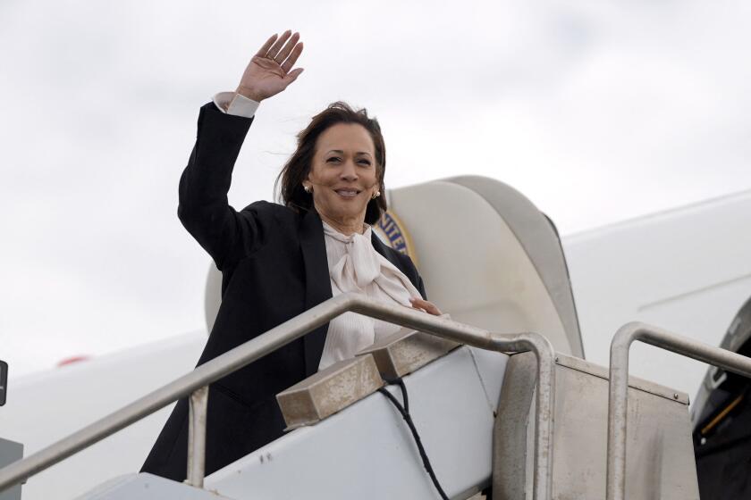 US Vice President and Democratic presidential candidate Kamala Harris waves as she boards Air Force Two at San Francisco International Airport on August 11, 2024,in San Francisco, California, as she returns to Washington, DC. (Photo by Julia Nikhinson / POOL / AFP) (Photo by JULIA NIKHINSON/POOL/AFP via Getty Images)