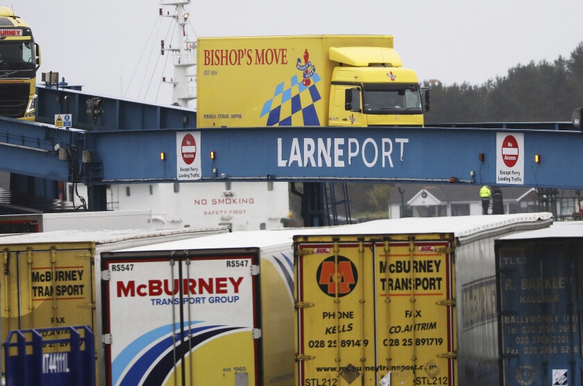 FILE - In this file photo dated Tuesday, Feb. 2, 2021, vehicles disembark from a ferry arriving from Scotland at the port of Larne, Northern Ireland. Outlawed Loyalist paramilitary groups in Northern Ireland have written to Britain's prime minister Thursday March 4, 2021, saying they are temporarily withdrawing their support for the historic 1998 peace accord because of disruption caused by new post-Brexit trade rules. (AP Photo/Peter Morrison, FILE)