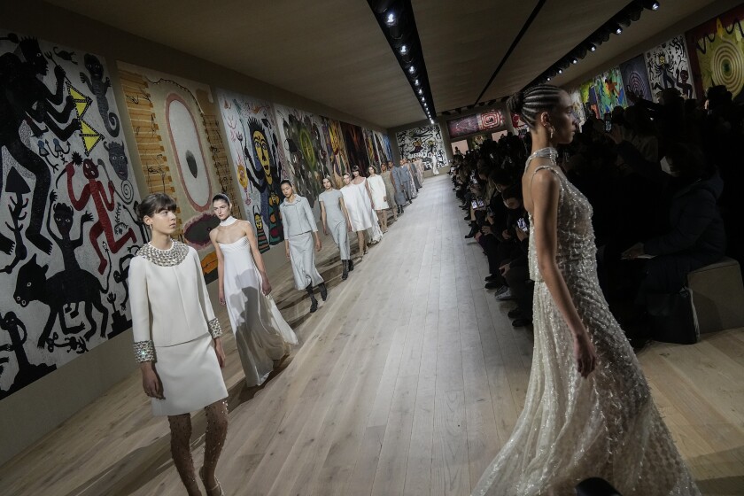 Models wear creations for the Dior Spring-Summer 2022 Haute Couture fashion collection collection, in Paris, Monday, Jan. 24, 2022. (AP Photo/Michel Euler)