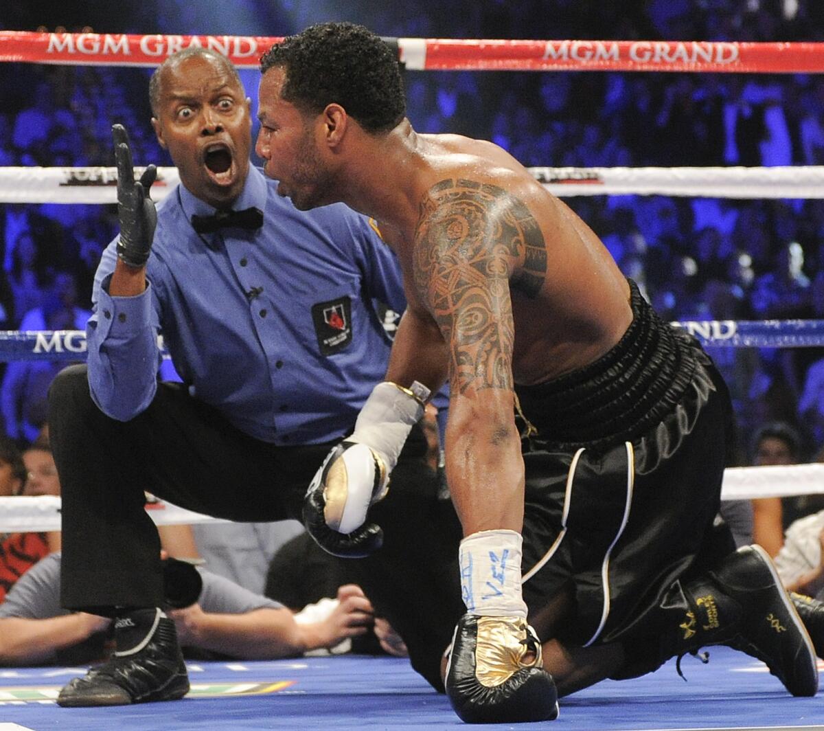 Referee Kenny Bayless issues the count on Shane Mosley, who was knocked down in the third round by Manny Pacquiao on May 7, 2011.