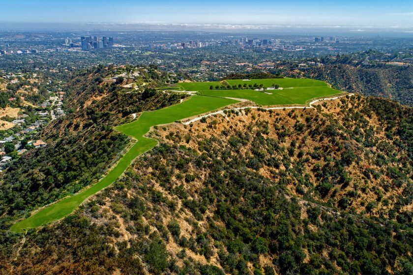 The property reigns over the city at Beverly Hills’ highest point, soaking in panoramic views from downtown L.A. to the Pacific Ocean to Catalina Island.