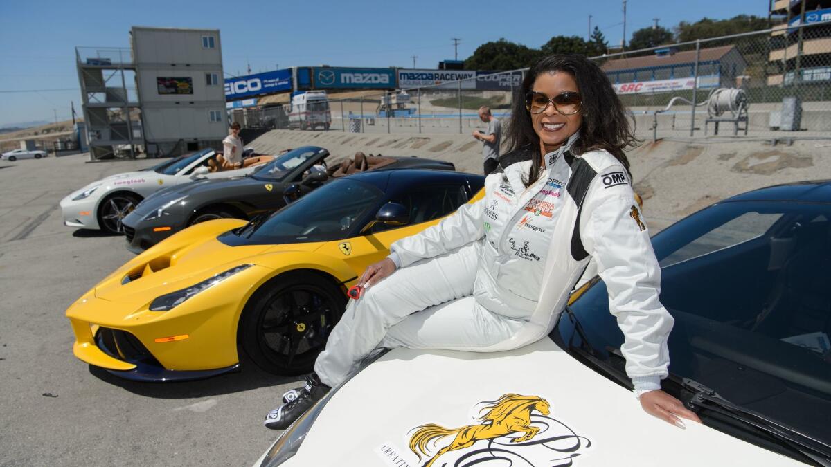 Ferrari owner and car club founder Chanterria McGilbra attends a race event at Monterey's Laguna Seca track.