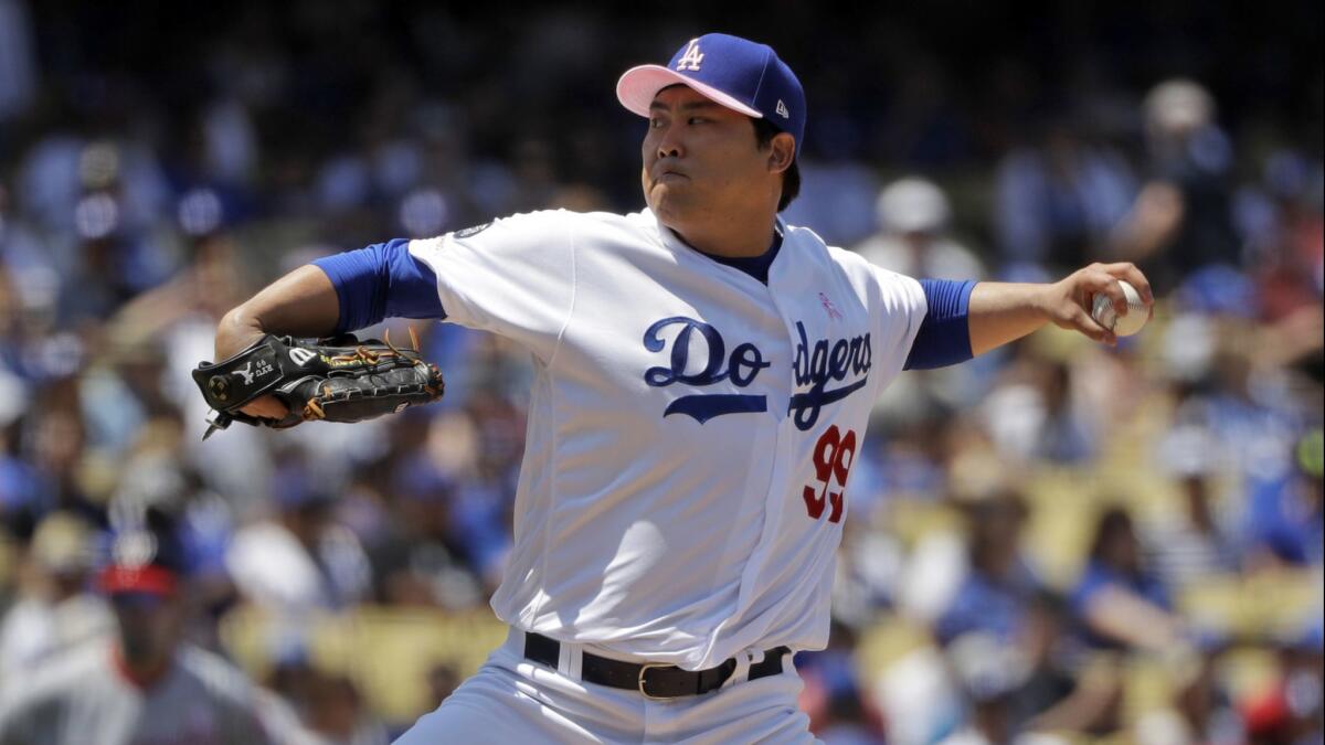 Dodgers starter Hyun-Jin Ryu delivers during the third inning against the Washington Nationals on Sunday.