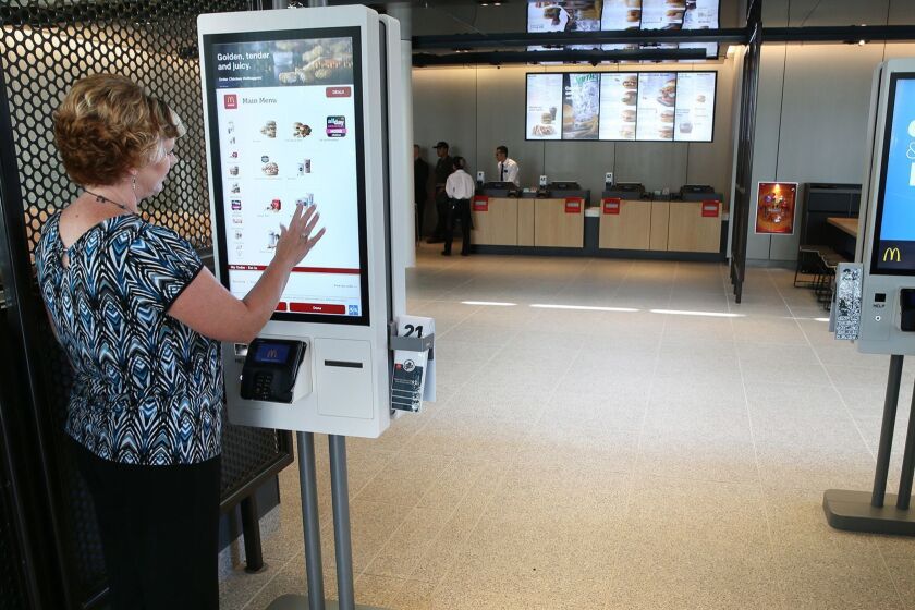 Self-service kiosks at a McDonald's restaurant at Ontario and Clark streets in Chicago, Ill. on Wednesday, Aug. 8, 2018. McDonald's plans to pay $300 million to acquire technology company Dynamic Yield, whose software will allow the fast food giant to personalize its digital menu boards and push additional items based on what a customer has just ordered. (Terrence Antonio James/Chicago Tribune/TNS) ** OUTS - ELSENT, FPG, TCN - OUTS **