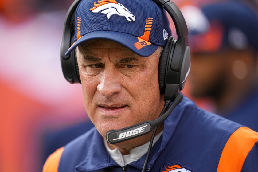FILE - Denver Broncos head coach Vic Fangio looks on before an NFL football game against the Los Angeles Chargers Sunday, Nov. 28, 2021, in Denver. Fangio has been fired as coach of the Denver Broncos after going 19-30 in three seasons. Fangio was fired Sunday morning, Jan. 9, 2022, one day after Denver’s season-ending 28-24 loss to Kansas City. (AP Photo/Jack Dempsey, File)