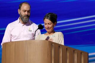 DNC CHICAGO, IL AUGUST 21, 2024 - Jon Polin, left, and Rachel Goldberg, parents of Hersh Goldberg-Polin, speak at the Democratic National Convention Wednesday, Aug. 21, 2024, in Chicago. (Robert Gauthier/Los Angeles Times)