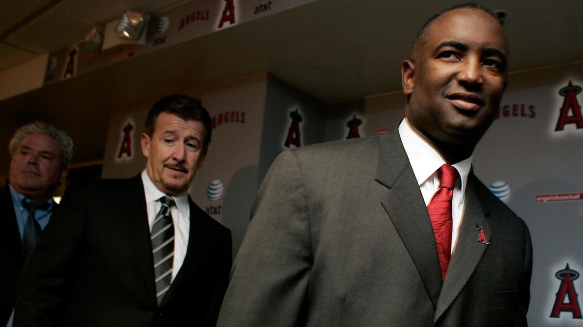 Tony Reagins, front, was the fourth African American general manager in major league history when he got the job with the Angels in 2007. Team owner Arte Moreno is the only minority controlling owner in the league.