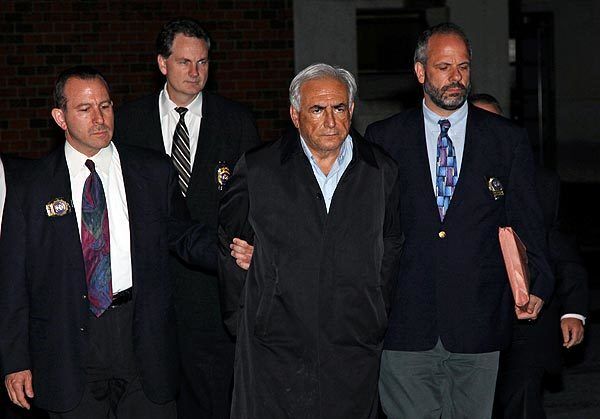 Dominique Strauss-Kahn is led from a police station shortly after his arrest.