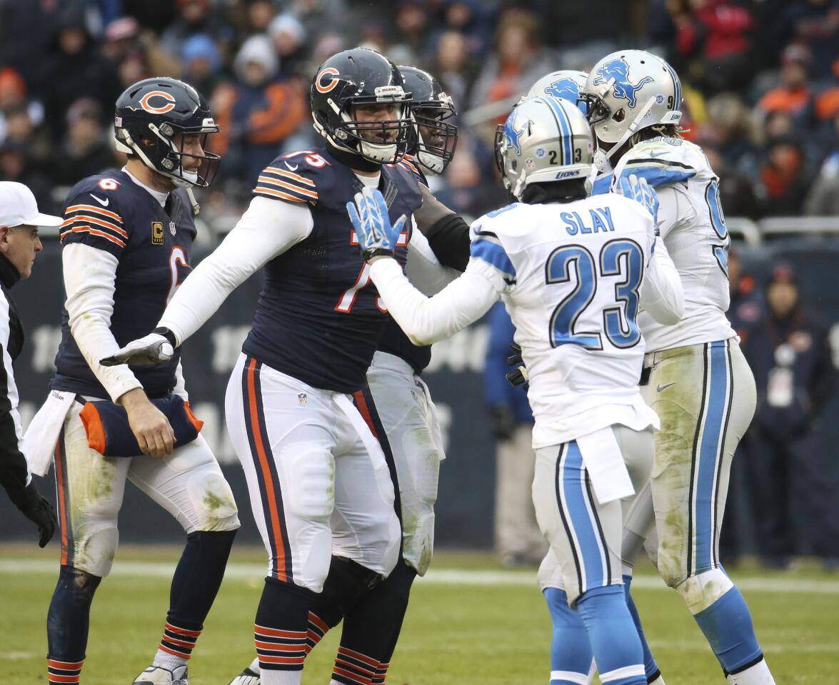 Jay Cutler and Kyle Long confront Lions players after Cutler gave up an interception to Glover Quin during the second half at Soldier Field.