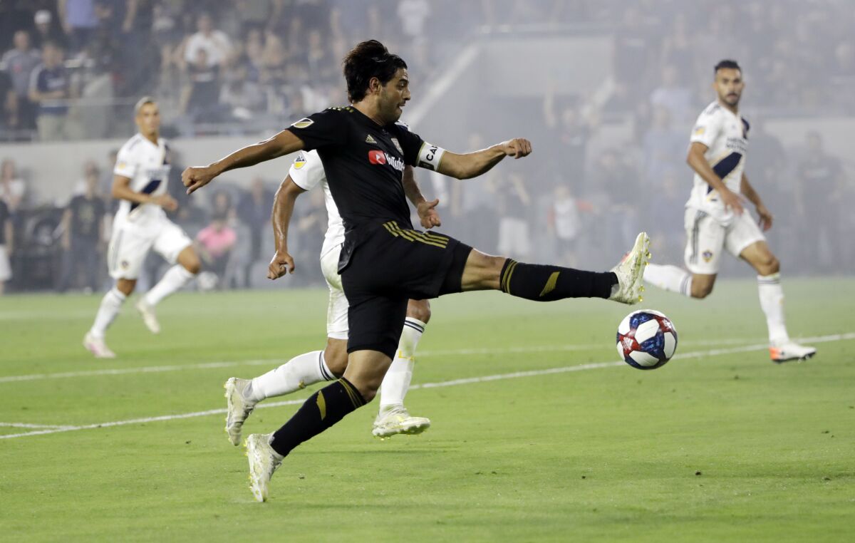 LAFC's Carlos Vela takes a shot during a game against the Galaxy on Aug. 25, 2019. 