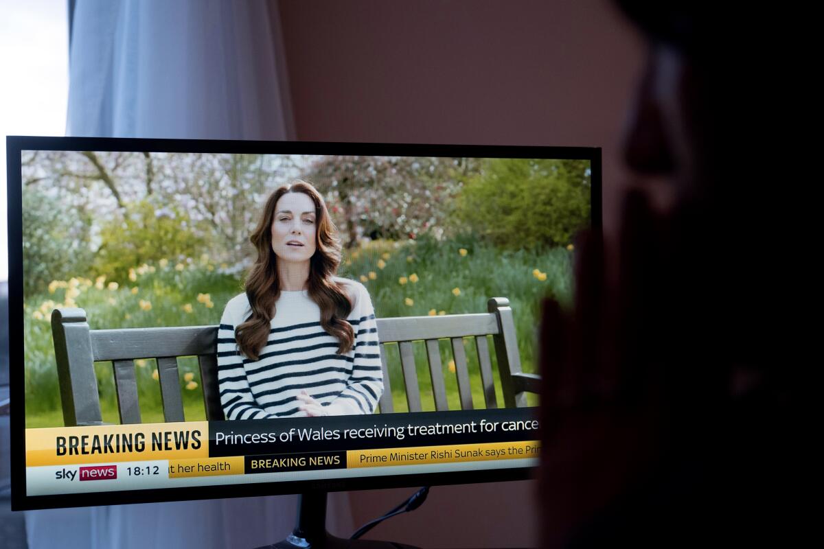 An image of a TV with Kate Middleton speaking.