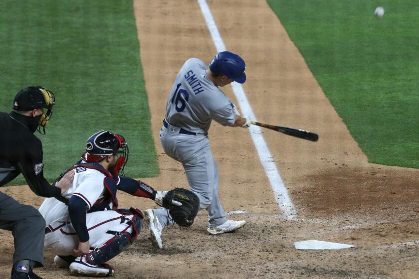 The Dodgers' Will Smith hits a three-run, go-ahead home run in the sixth inning of Game 5 of the NLCS on Oct. 16, 2020.