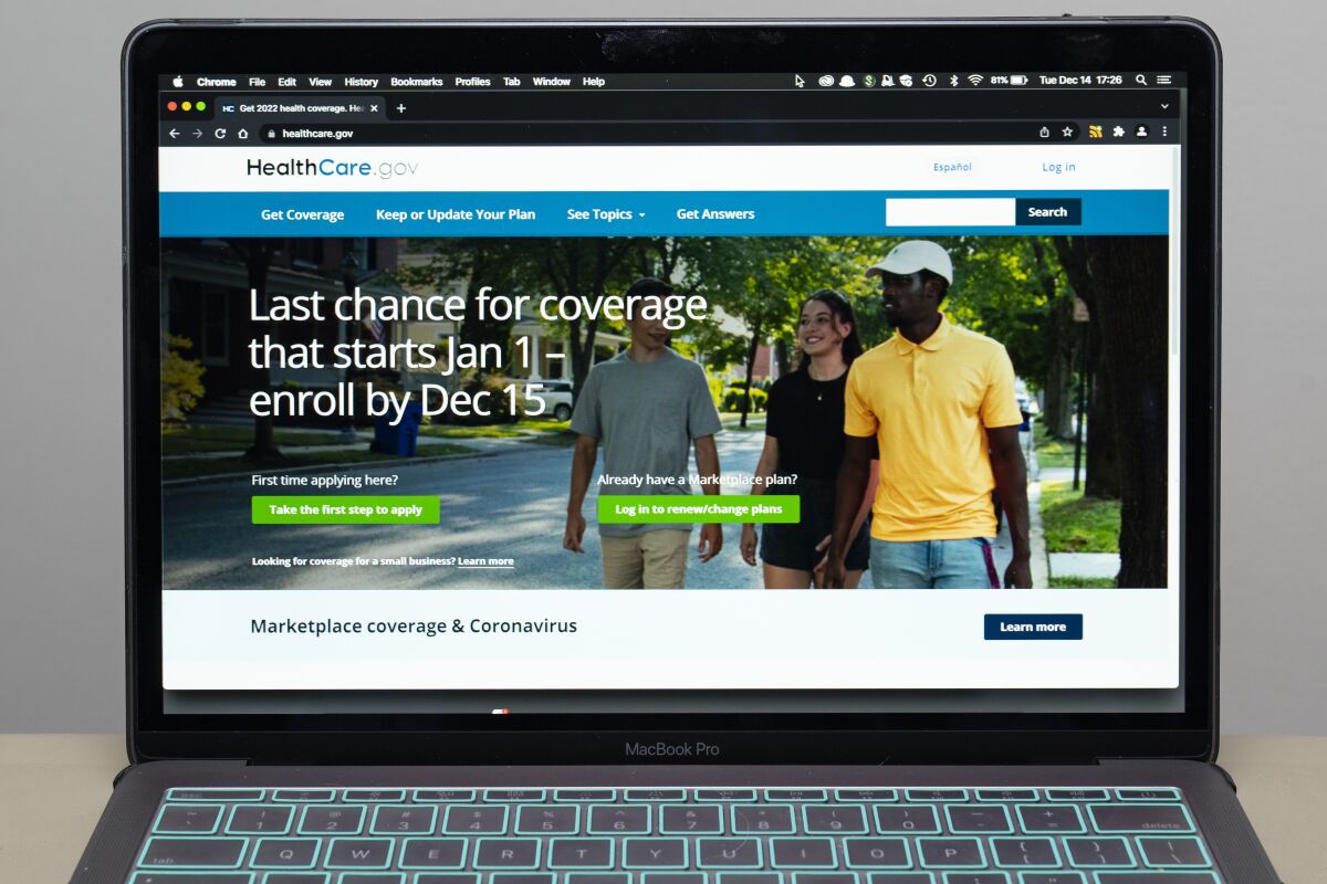 FILE - The healthcare.gov website is seen, on Dec. 14, 2021 in Fort Washington, Md. Millions of people in the United States will be spared from big increases in health care costs next year after President Joe Biden signed legislation extending generous subsidies for those who buy plans through federal and state marketplaces. (AP Photo/Alex Brandon, File)