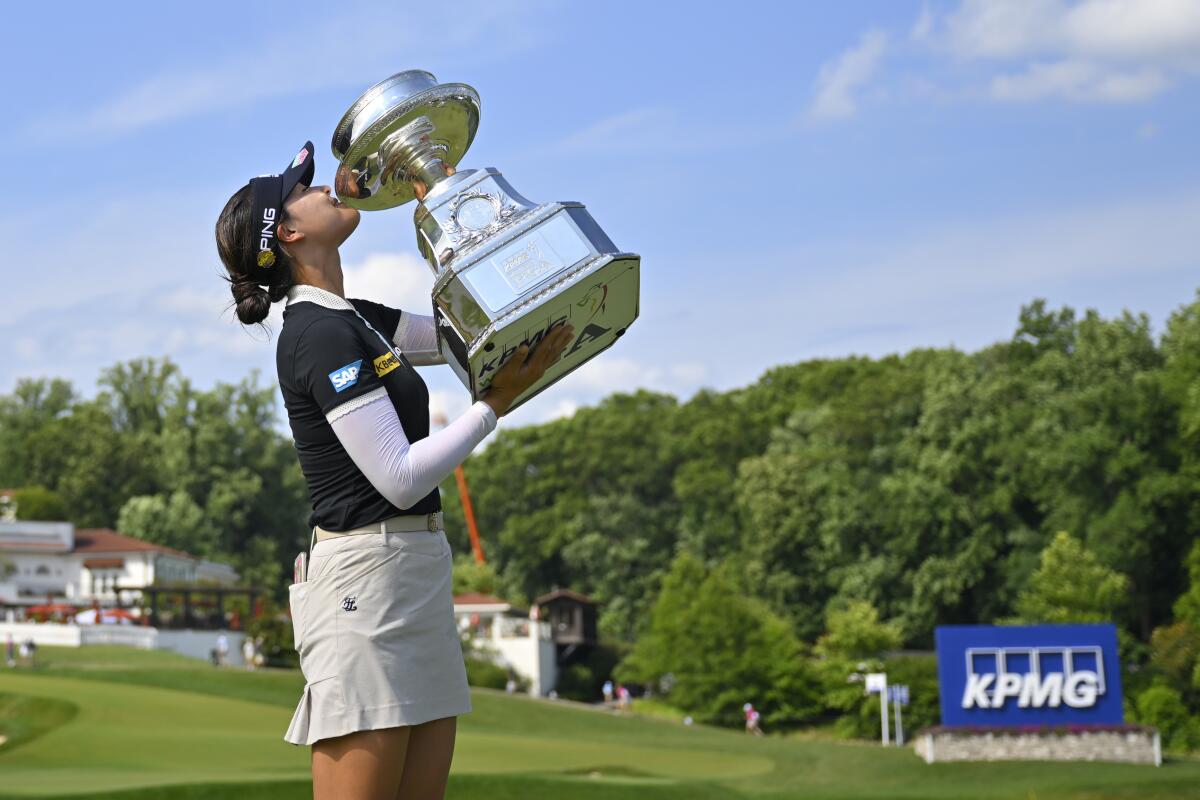 In Gee Chun kisses the trophy after winning the KPMG Women's PGA Championship on Sunday, June 26, 2022, in Bethesda, Md.