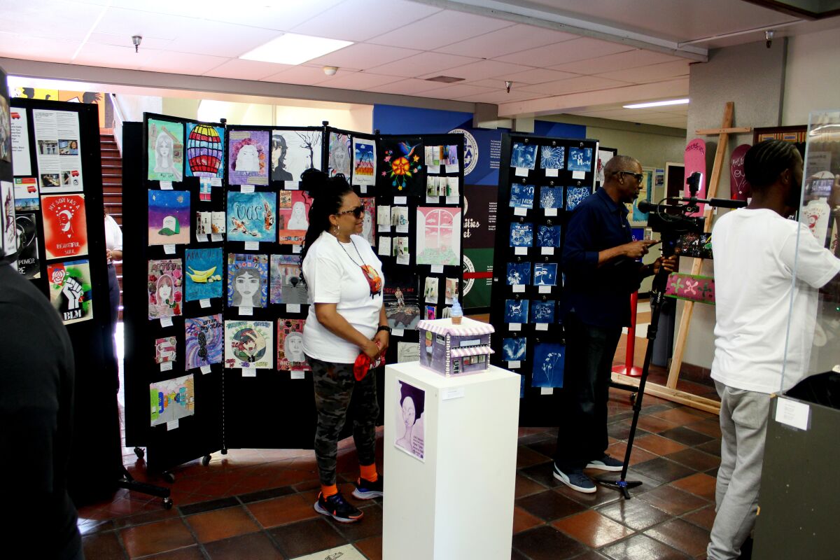 Posters on display at an art show.