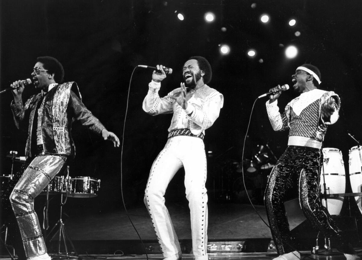 Maurice White, center, leads Earth Wind & Fire at the Forum in Inglewood in 1981.