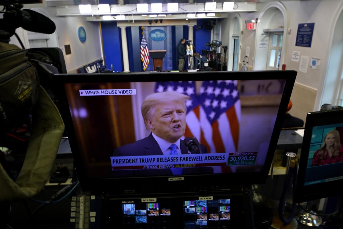 President Trump is seen on a network monitor after his prerecorded farewell speech was released.