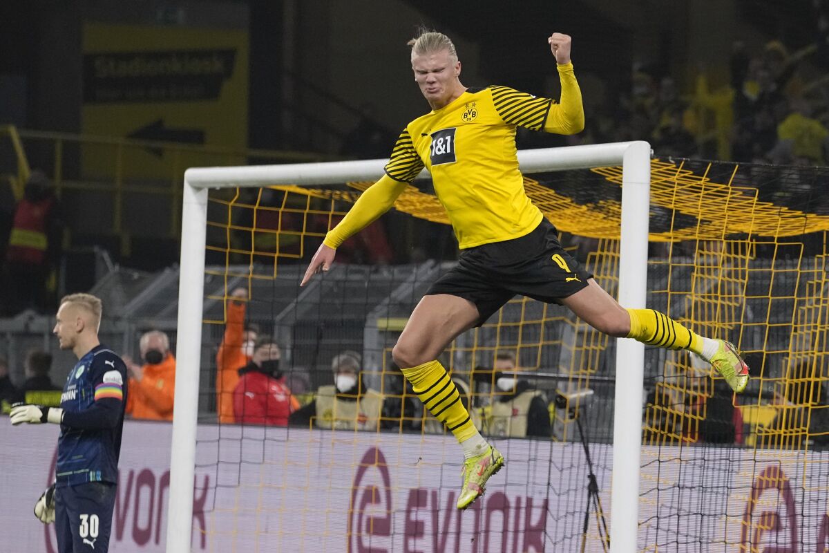 Dortmund's Erling Haaland celebrates his second goal during the German Bundesliga soccer match between Borussia Dortmund and Greuther Fuerth in Dortmund, Germany, Wednesday, Dec. 15, 2021. (AP Photo/Martin Meissner)