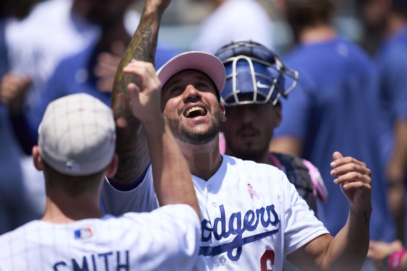 Los Angeles Dodgers left fielder David Peralta (6) cheers before the start of a baseball game against the San Diego Padres Sunday, May 14, 2023, in Los Angeles. (AP Photo/Allison Dinner)