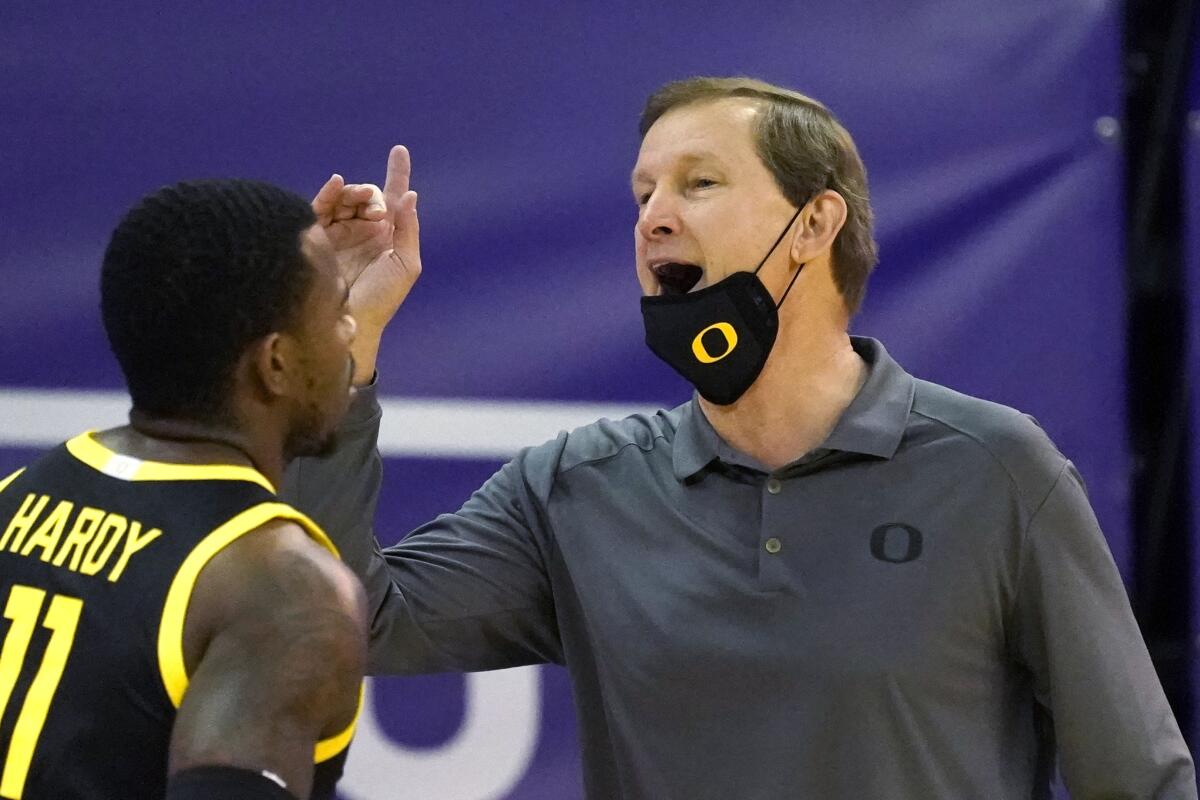 Oregon head coach Dana Altman motions to his team.