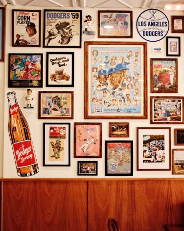 An interior wall of LaSorted's pizzeria in Chinatown filled with vintage sports memorabilia.