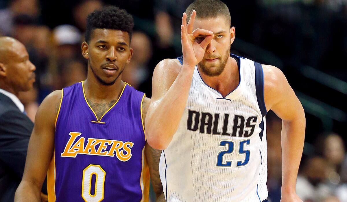 Mavericks forward Chandler Parsons celebrates after scoring against Nick Young (0) and the Lakers in the second half.