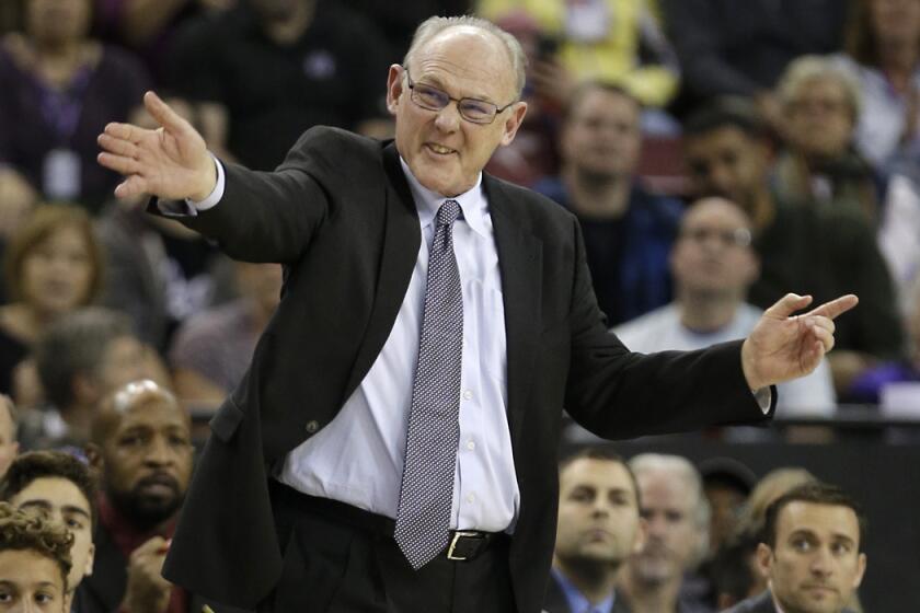 Sacramento Kings head coach George Karl directs his team during the second half against the Phoenix Suns on Saturday.