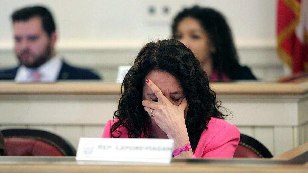 Democratic Ohio state Rep. Michele Lepore-Hagan wipes away tears during a hearing on the bill to ban abortion after a fetal heartbeat is detected.