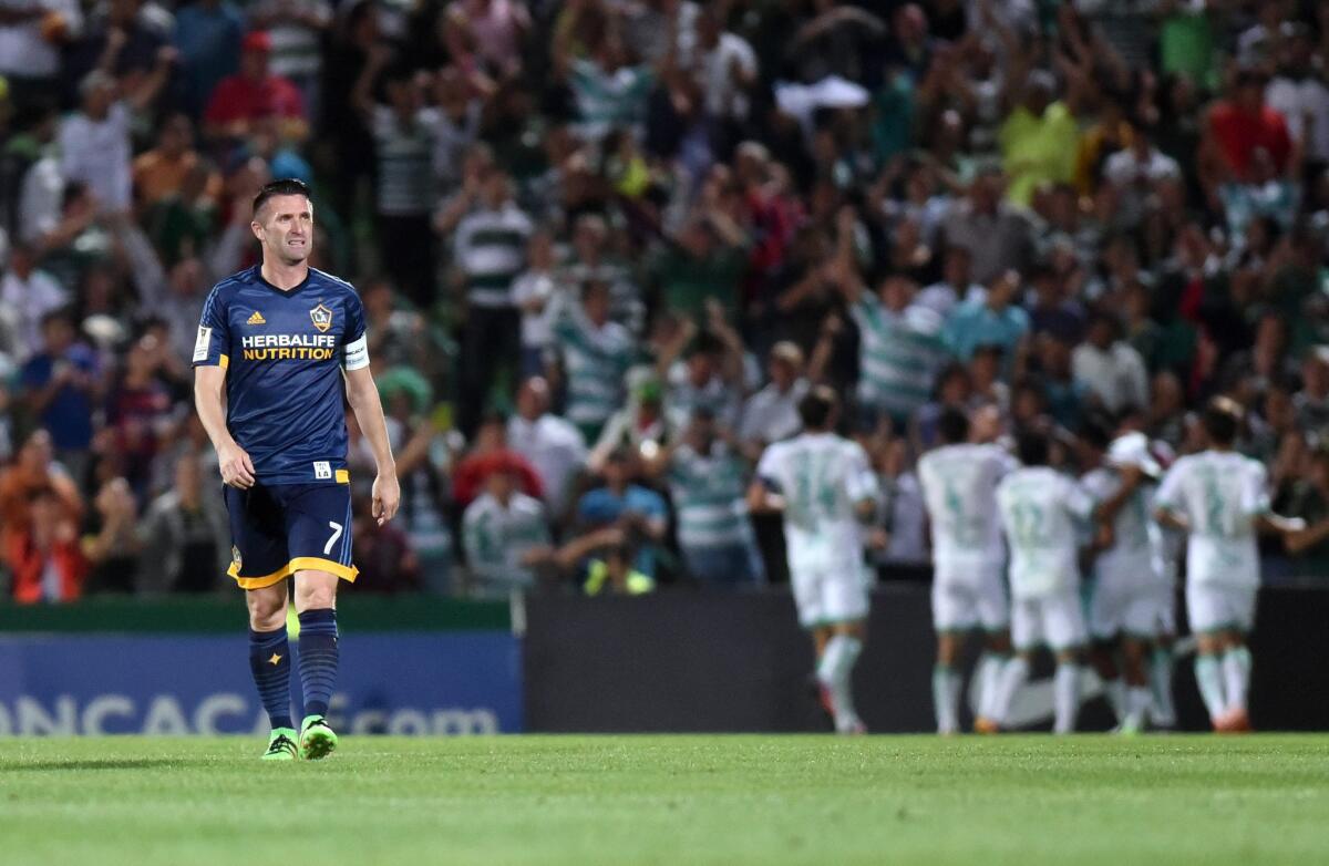 Robbie Keane looks on as Santos Laguna's players celebrate a goal against the Galaxy during the second leg of their CONCACAF Champions League matchup on March 1.