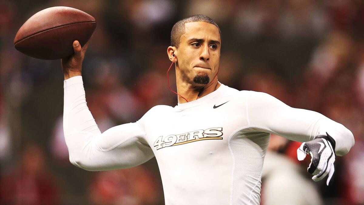 Colin Kaepernick warms up before Super Bowl XLVII on Feb. 3, 2013.