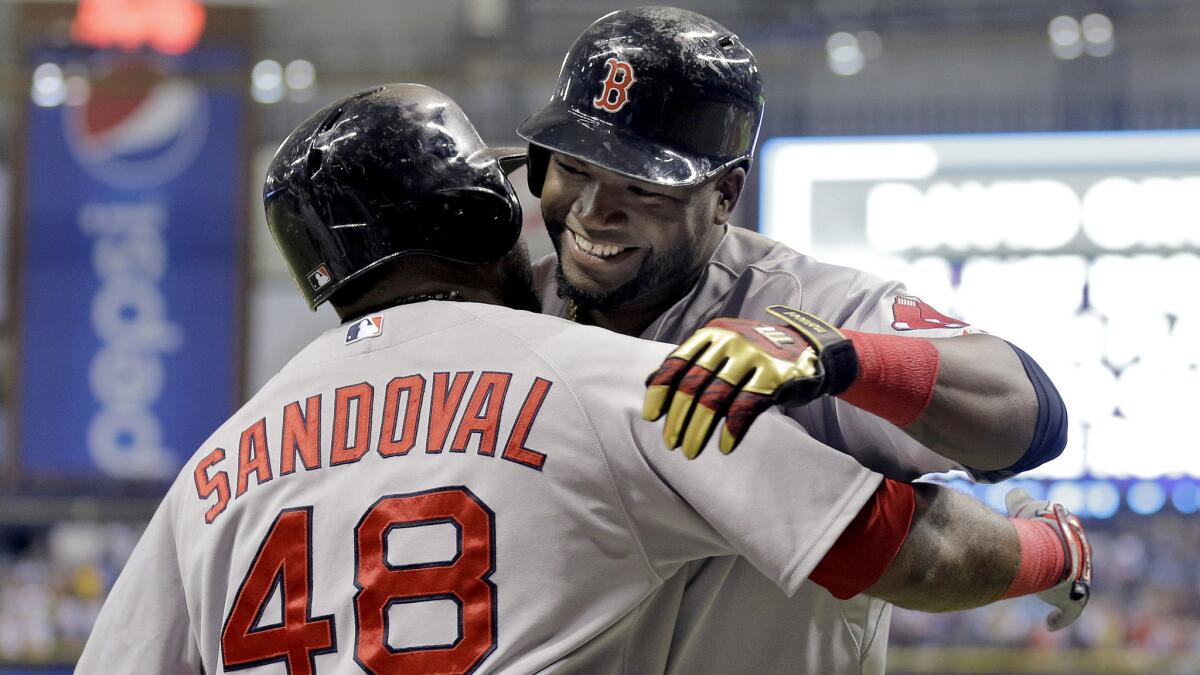 Red Sox slugger David Ortiz is congratulated by teammate Pablo Sandoval after hitting his 500th career home run off Tampa Bay Rays starting pitcher Matt Moore in the fifth inning Saturday.