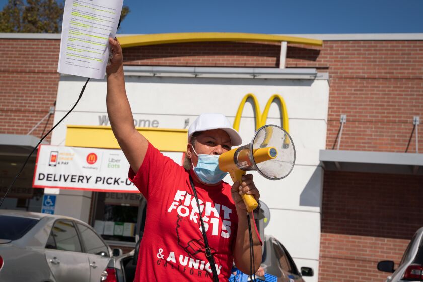 Maria Ruiz leads protesters during a strike to protect essential workers at McDonald's in Oakland, Calif., on Friday, Oct. 16, 2020. Credit: Sarahbeth Maney for Reveal