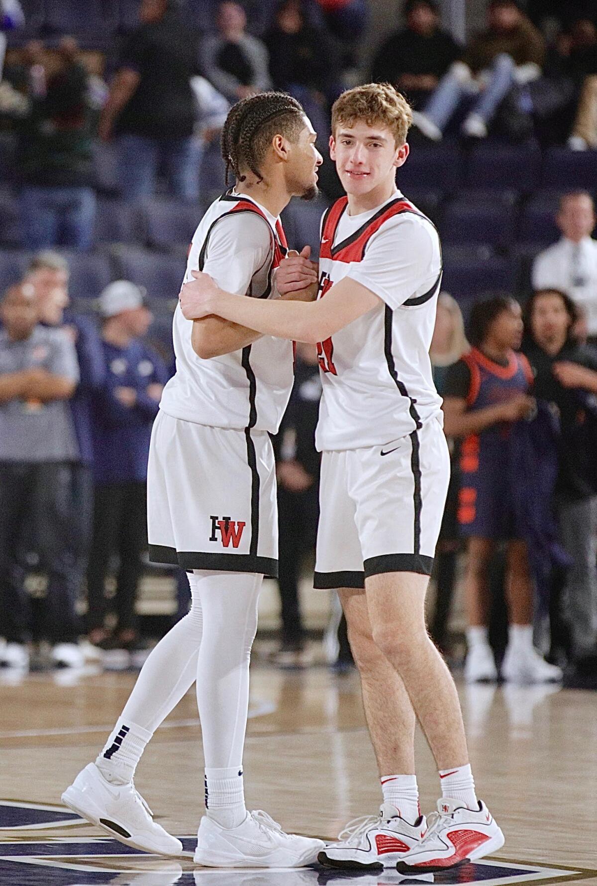 Harvard-Westlake players embrace after a game.