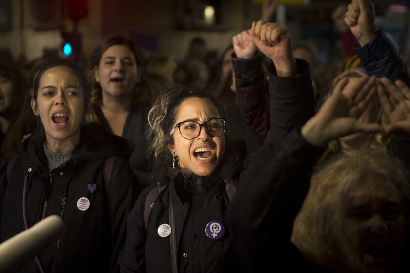 Protesters shout outside the Justice Ministry in Madrid on Monday after five men accused of gang raping an unconscious 14-year-old  were sentenced  for sexual abuse instead of assault or rape.