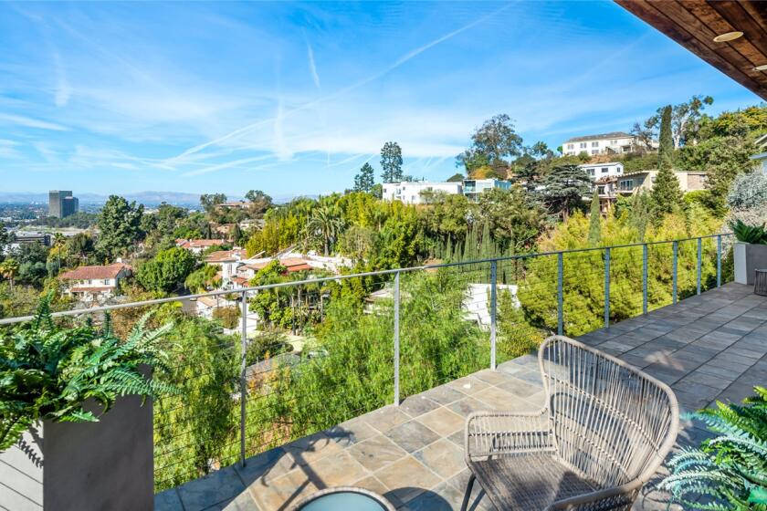 Spanning three stories, the 1960s home has light-filled living spaces with clerestories, skylights and walls of glass.