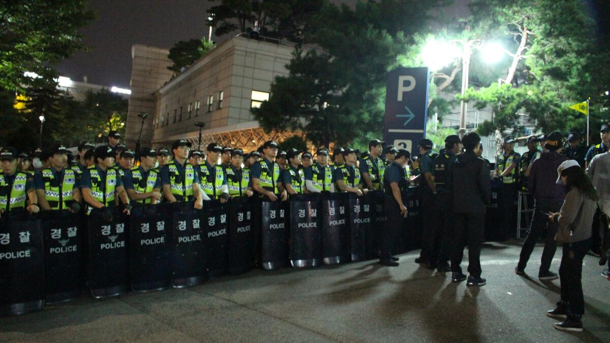 South Korean riot police block off an entrance to Seoul National University Hospital funeral home during a service for deceased farmer and activist Baek Nam-gi on Sep. 25, 2016.