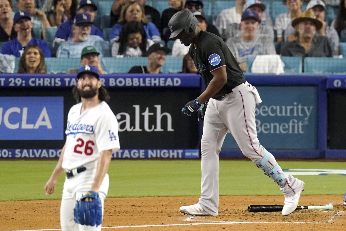 Miami Marlins' Jorge Soler heads to first for a solo home run as Dodgers pitcher Tony Gonsolin watches.